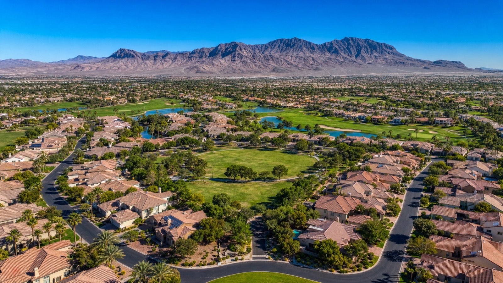 Aerial view of the Aliante master-planned community in North Las Vegas with golf course, park, and homes